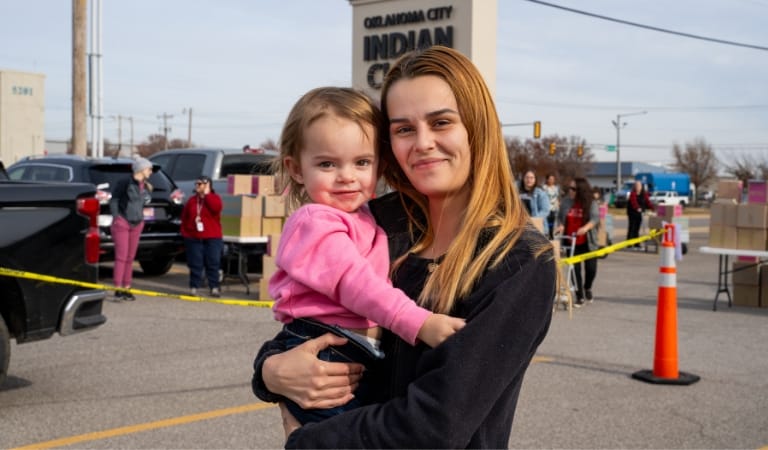 A woman and daughter at an outdoor event